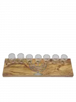 A wooden seven-candle holder with a small menorah painted on it