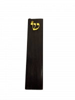 A case for a mezuzah with a small pattern ש